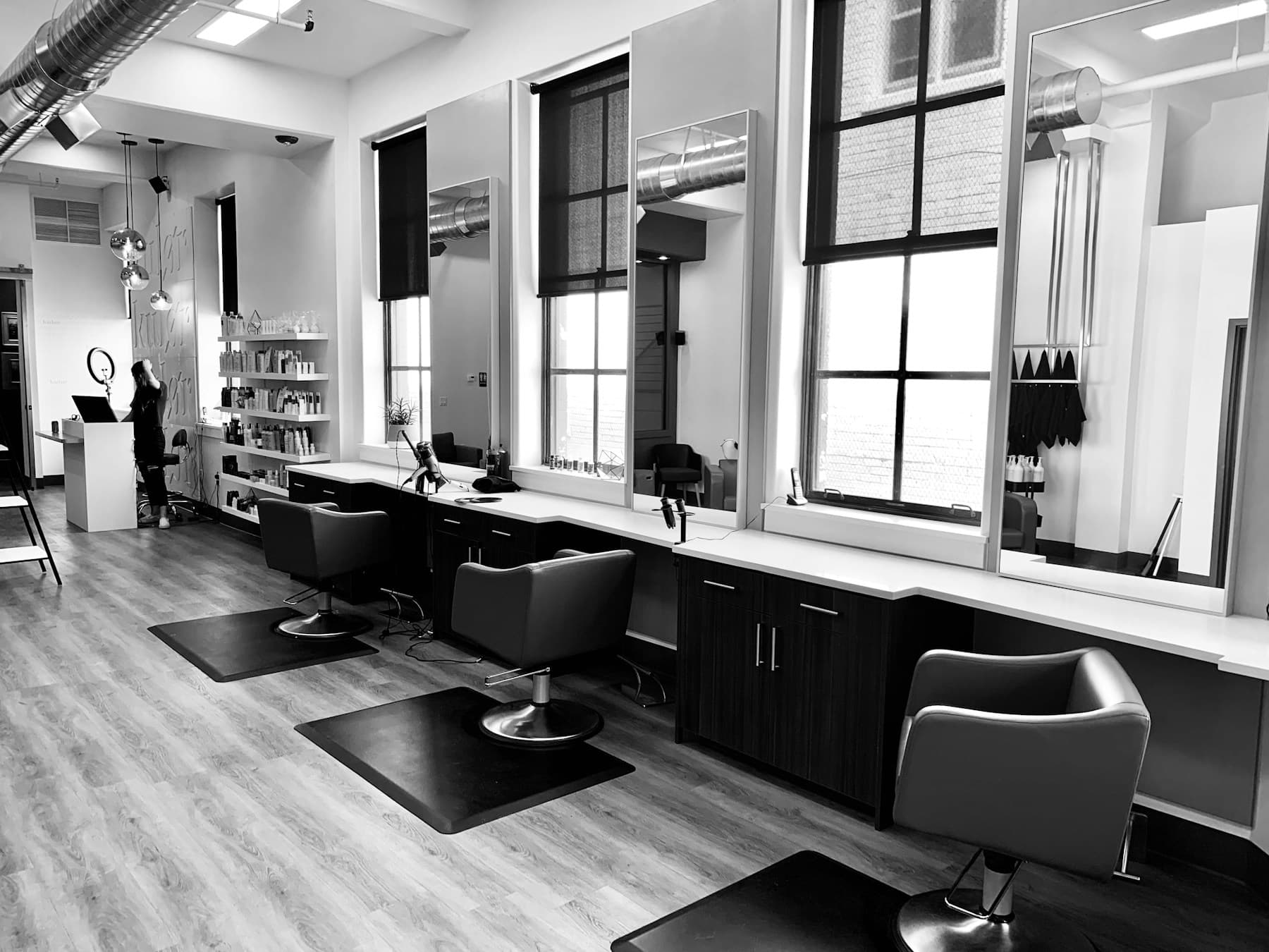 Stylist caring for a client in a bright premium salon